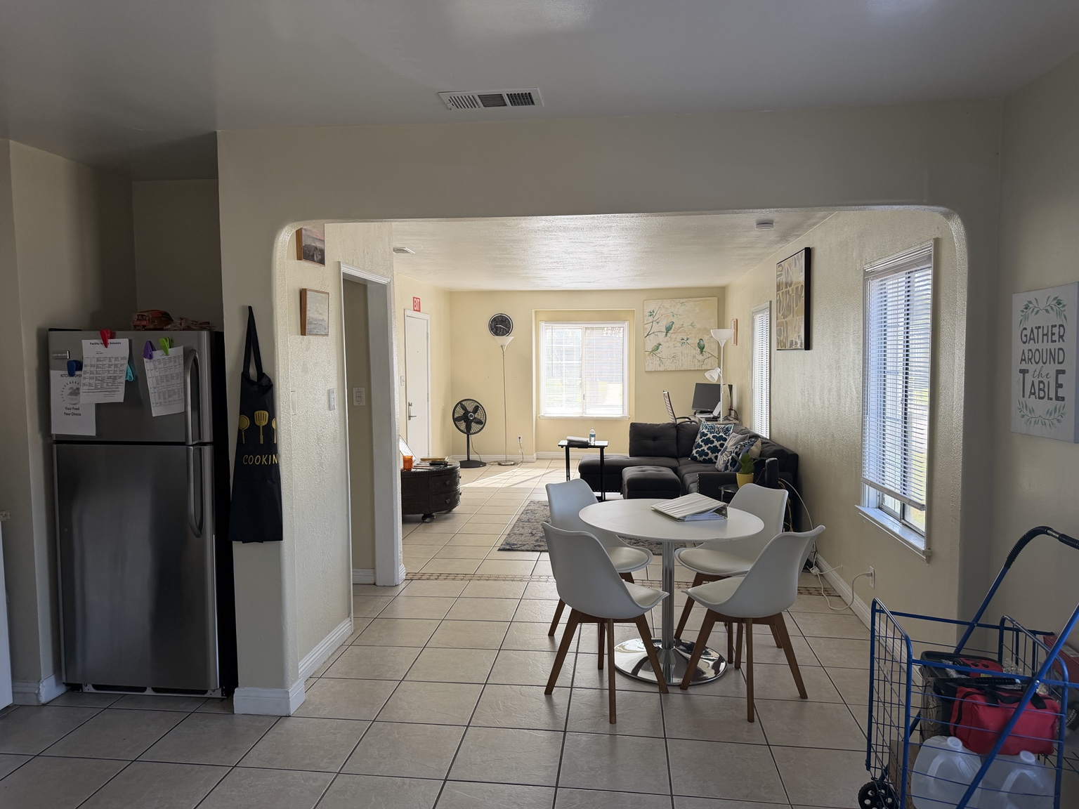 BMORE’s shared dining and living spaces, with a dining table and comfortable seating